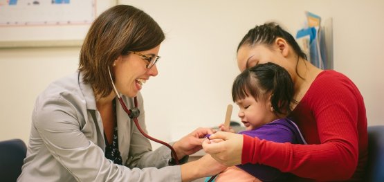 Doctor with mother and child
